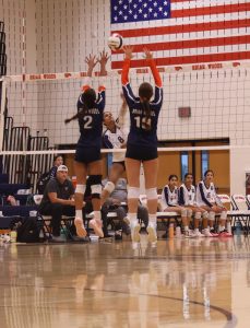 Varsity Number 2 and 10 going up for the block.