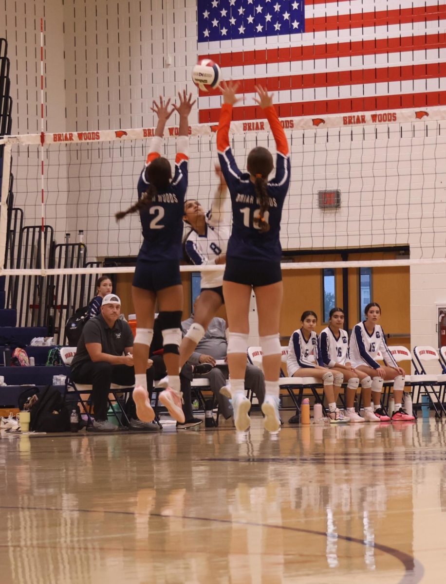 Varsity Number 2 and 10 going up for the block.