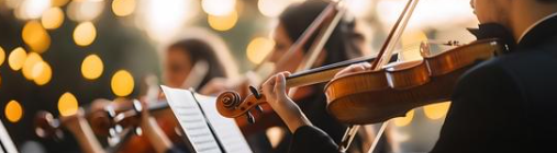 "Violinist Performing with Orchestra" by baehakqinugroho via Canva