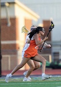Gabby Mejia playing lacrosse